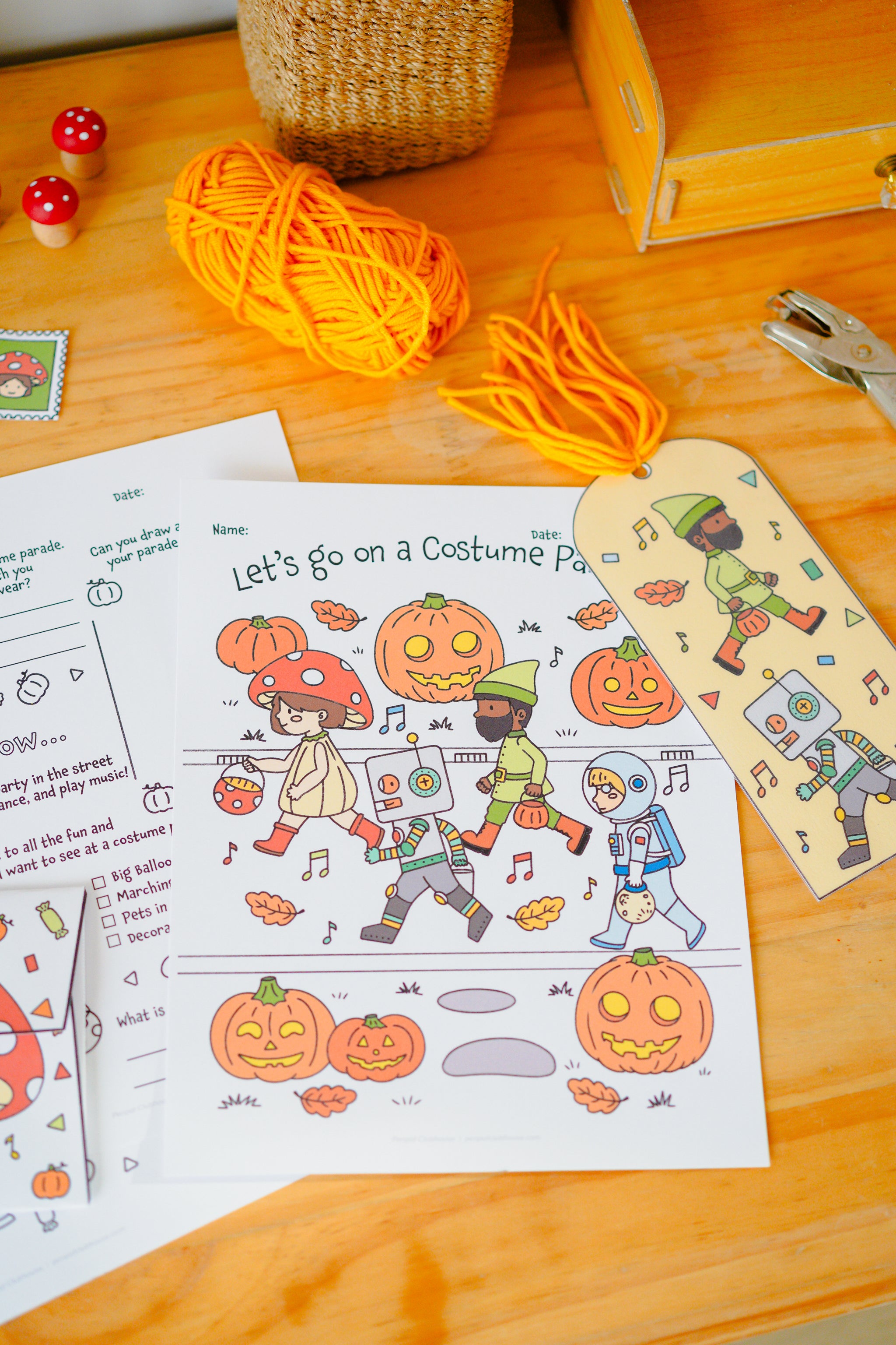 A Halloween-themed printable activity sheet titled 'Let's Go on a Costume Parade.
